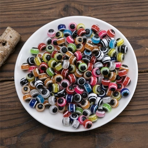 Macro view of colorful resin evil eye beads with stripes for DIY jewelry making