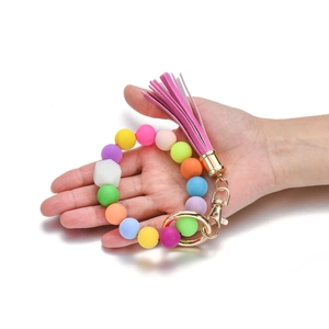 Bracciale portachiavi con perline di silicone colorate con nappa rosa e gancio dorato