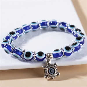 Bracelet en résine Evil Eye avec perles bleues et pendentif tortue argentée protectrice
