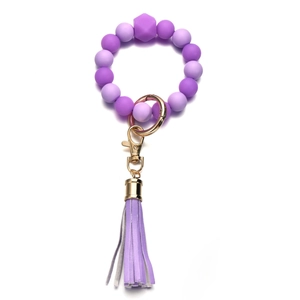 Bracciale portachiavi in perle di silicone viola con nappa in pelle PU e anello dorato