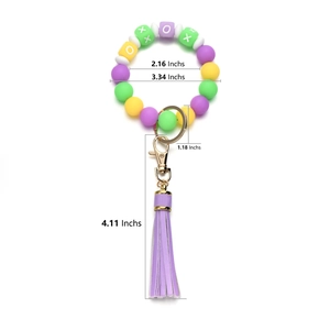 Silicone bead wristlet keychain with colorful beads, purple tassel, and gold metal hardware