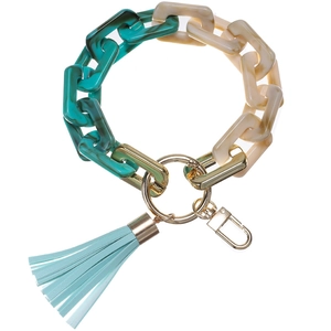 Detail of green marble acrylic chain keychain with light blue leather tassel and gold ring