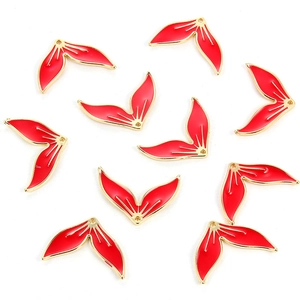 Detail of red enamel mermaid tail pendants with golden edges for DIY jewelry making