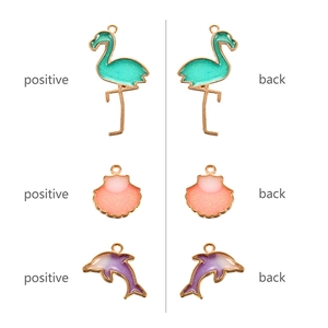 Front and back view of colorful flamingo, shell, and dolphin alloy charms for DIY jewelry