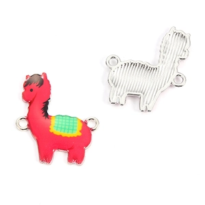 Detail of red alpaca enamel charm with double rings and silver textured metal back