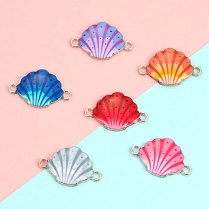 Detailed macro view of colorful shell-shaped alloy enamel connectors for DIY jewelry making