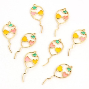 Detailed view of eight gold-plated balloon heart charms for DIY jewelry making