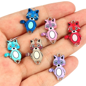 Close-up of colorful enamel raccoon charms for DIY jewelry bracelets and necklaces