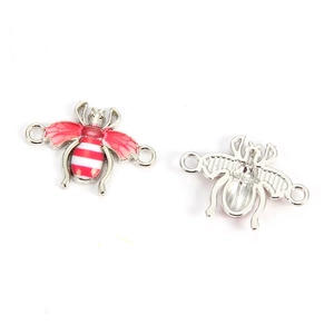 Detail of bee alloy charms with red drip oil finish and silver hollow back for DIY jewelry