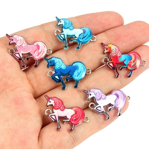 Close-up of six colorful unicorn jewelry connectors for DIY bracelets and necklaces