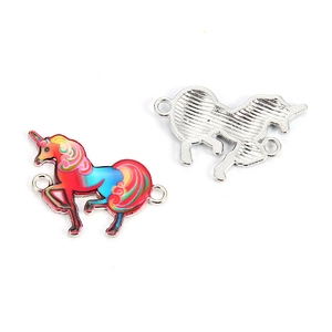 Detail view of unicorn DIY charm with rainbow oil drip finish and silver metal back
