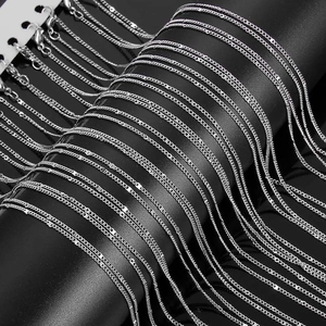 Selection of polished silver metal chains including snake and cross link styles for jewelry DIY