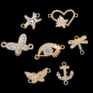 Lot de connecteurs DIY dorés avec strass, motifs papillon, cœur et œil porte-bonheur