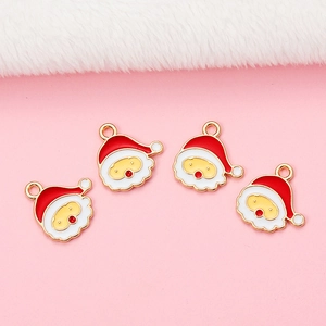 Set van vier kerstman hangers van rood emaille en goud voor het maken van DIY-sieraden