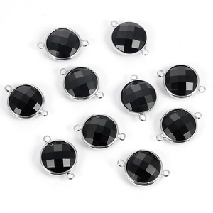 Detail of 10 round faceted black crystal connectors with silver-tone metal double loops