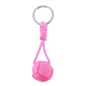 Handmade pink woven monkey fist rope keychain with a polished silver metal ring