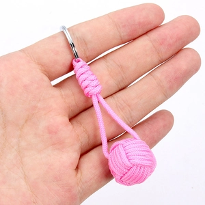 Handmade pink paracord keychain with silver metal ring and decorative monkey fist knot
