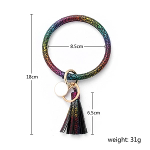 Rainbow faux leather bangle keychain with golden clasp, white tag, and stylish tassel