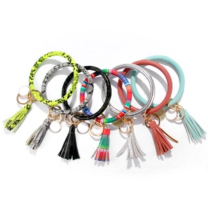 Set of colorful PU leather O-ring keychains with tassels and stylish animal patterns