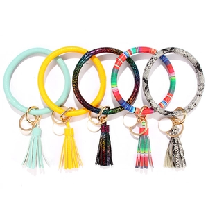 Five assorted PU leather wristlet keychains with colorful tassels and golden alloy rings