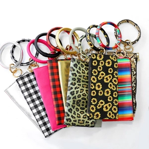 Fashion PU leather tassel keyring bracelet with multicolored card holders on white background