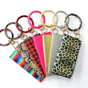 Set of stylish PU leather O-ring bracelet keychains with various patterns and zip pouches