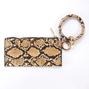 Detail of faux snakeskin leather zipper wallet with large round wristlet gold keychain