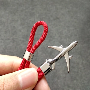 Bracelet en corde de parachute tressée rouge avec pendentif avion en argent poli chic