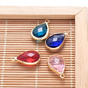 Set of four teardrop faceted glass crystal pendants with gold edges for DIY jewelry