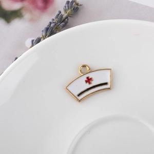 Nurse hat pendant in white enamel with a red cross and gold trim for DIY jewelry
