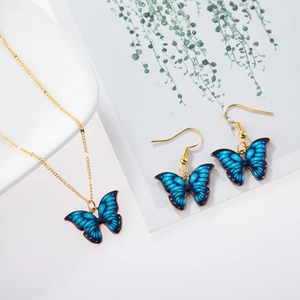 Elegant gold alloy jewelry set with blue gradient butterfly pendant necklace and earrings