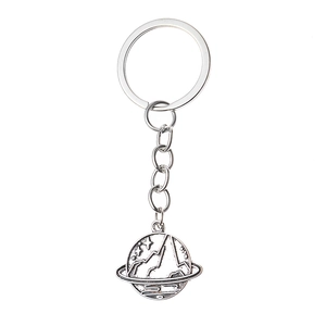 Detail view of silver planet and mountain relief pendant on minimalist keychain