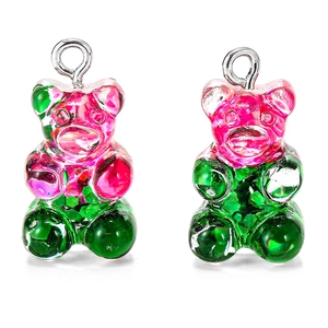 Detail of glitter-filled resin bear charms with pink and green gradient and silver rings