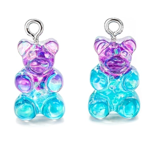 Close-up of translucent purple gradient gummy bear pendants with sparkling glitter