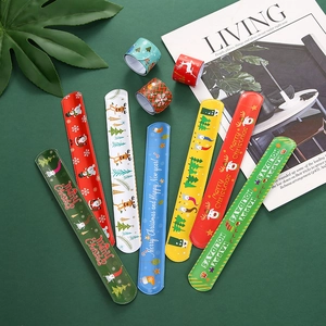 Christmas slap bracelets with Santa and reindeer patterns on a festive green background