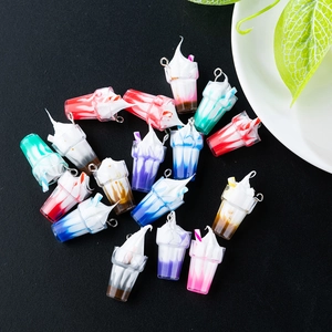 Macro detail of mini resin sundae cup charms with metal hooks for DIY jewelry making
