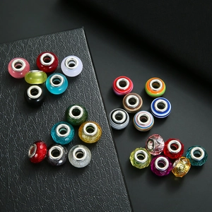Macro view of assorted crystal large hole beads with silver core for DIY jewelry