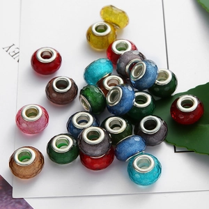 Macro shot of colorful faceted glass beads with metal cores for DIY jewelry making