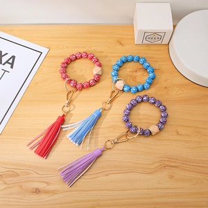 Three-piece set of marble-patterned beaded keychain bracelets with leather tassels and wood beads