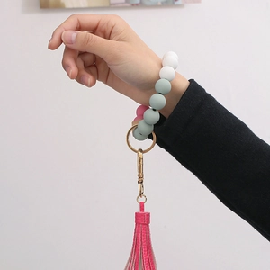Silicone bead wristlet keychain with pink leather tassel and golden metal clasp for women