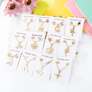12-piece gold stainless steel jewelry set featuring Eiffel Tower and star pendants