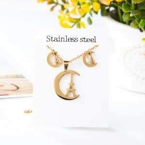 Golden stainless steel jewelry set featuring Eiffel Tower and crescent moon pendant