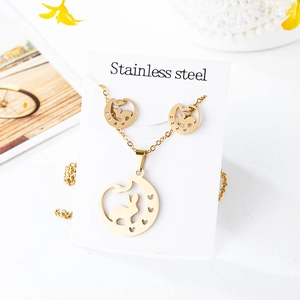 Detailed view of stainless steel jewelry set featuring hollow moon and rabbit charms