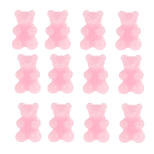 Detailed view of twelve translucent pink resin bears arranged in a 3x4 grid pattern