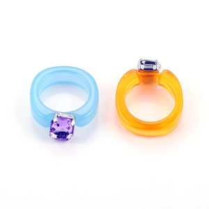 Y2K resin rings set in sky blue and bright orange with square gemstone claw setting