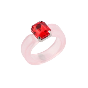 Detail of pink resin ring featuring a large rectangular red crystal in a prong setting