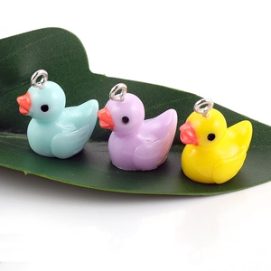 DIY colorful cartoon duck resin charms in blue, purple, and yellow for creative jewelry