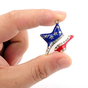 Macro view of star pendant with US flag enamel colors and inlaid rhinestones