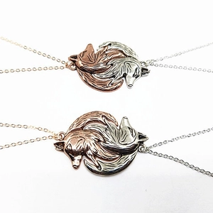 Interlocking wolf head couple necklaces in rose gold and silver finish with metal chains