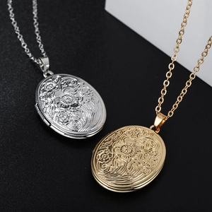Oval floral locket necklace with vintage embossed patterns in gold and silver finish